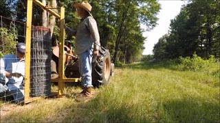 Unrolling And Stretching A Woven Wire Fence  The BEST Way [upl. by Bowles]