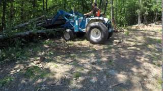 Cutting down trees with a tractor [upl. by Sirhc71]