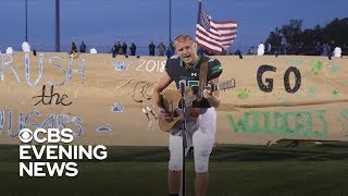 Football player stuns crowd with national anthem performance [upl. by Annek]